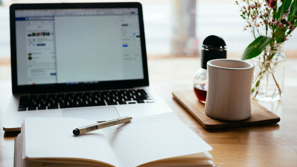 Computer and notebook at home office