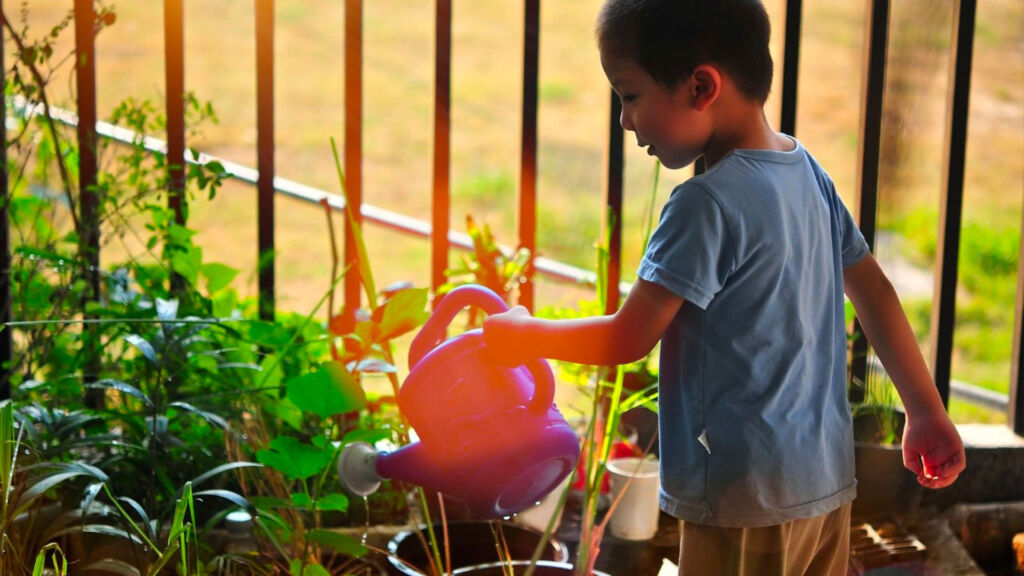 young boy gardening