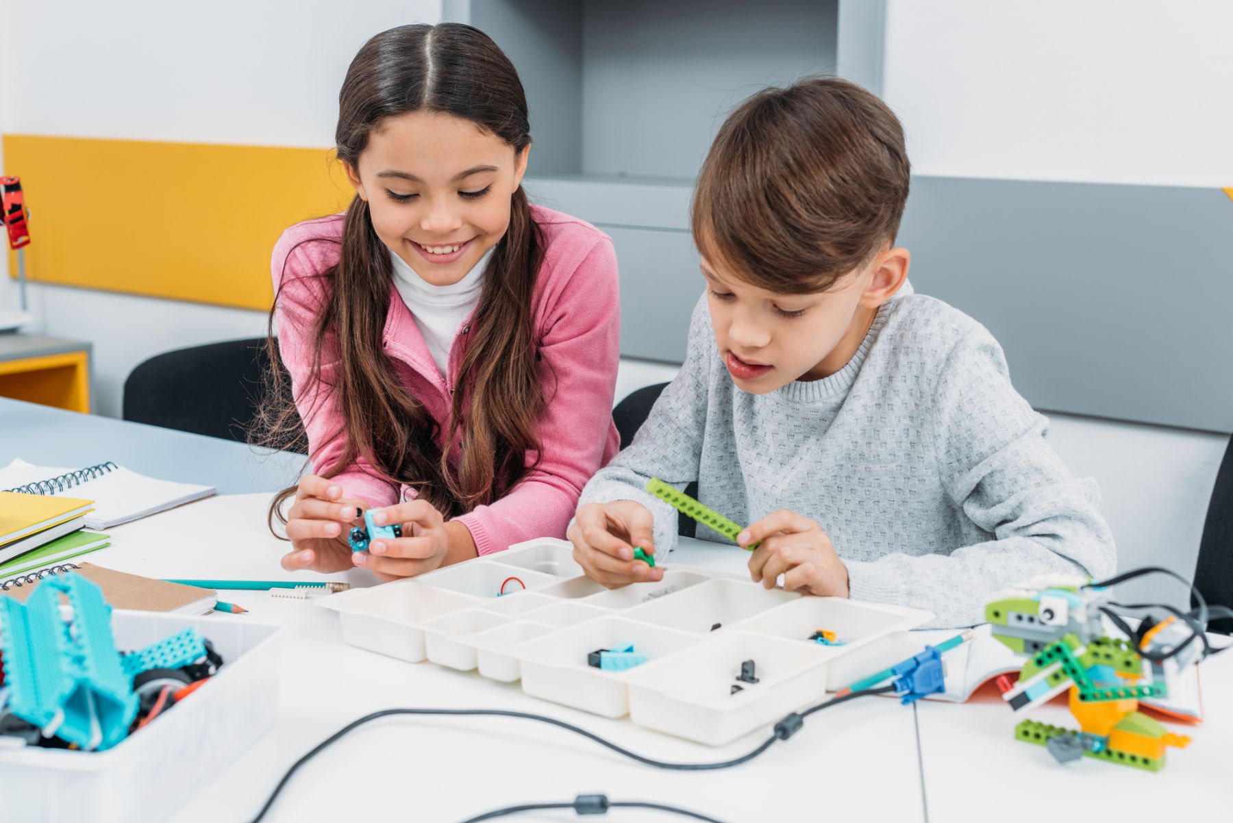 young students building small robots
