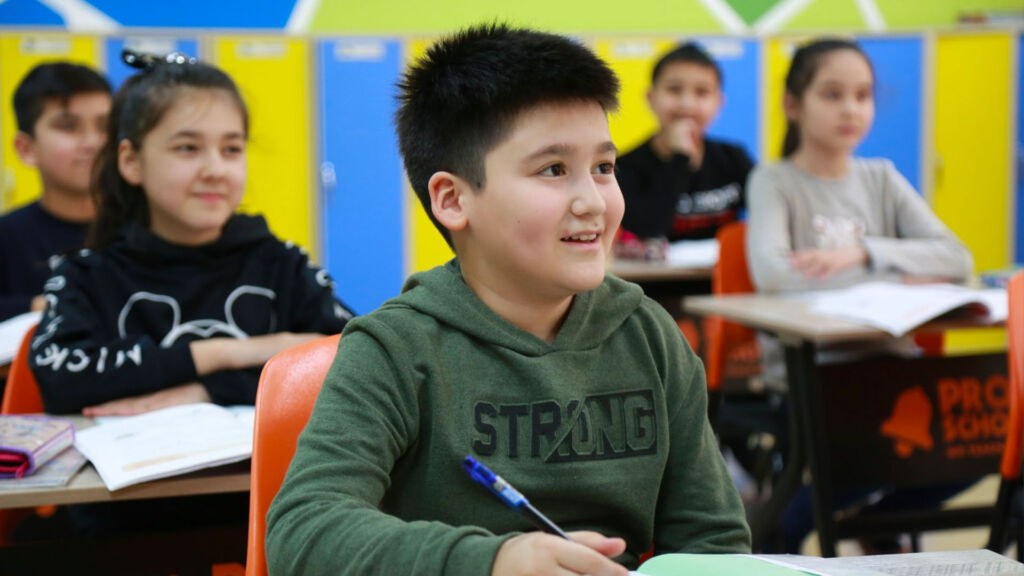 students writing in classroom