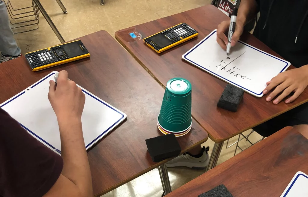 desks with school supplies on them