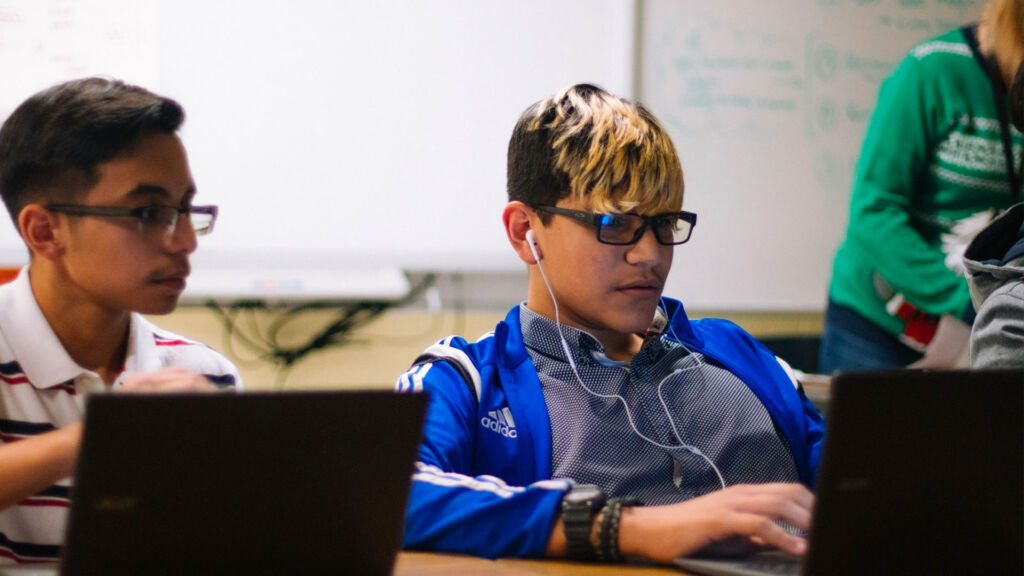 students working on computers in a classroom