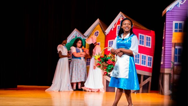 student performing as Belle