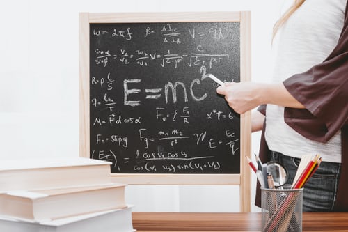 chalk board with math equation on it