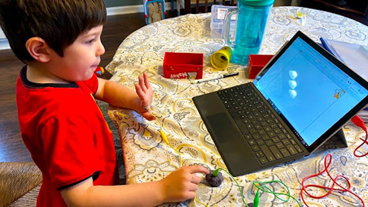 kid working at laptop