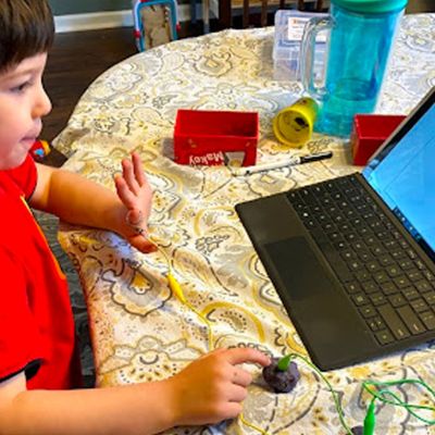 kid working at laptop