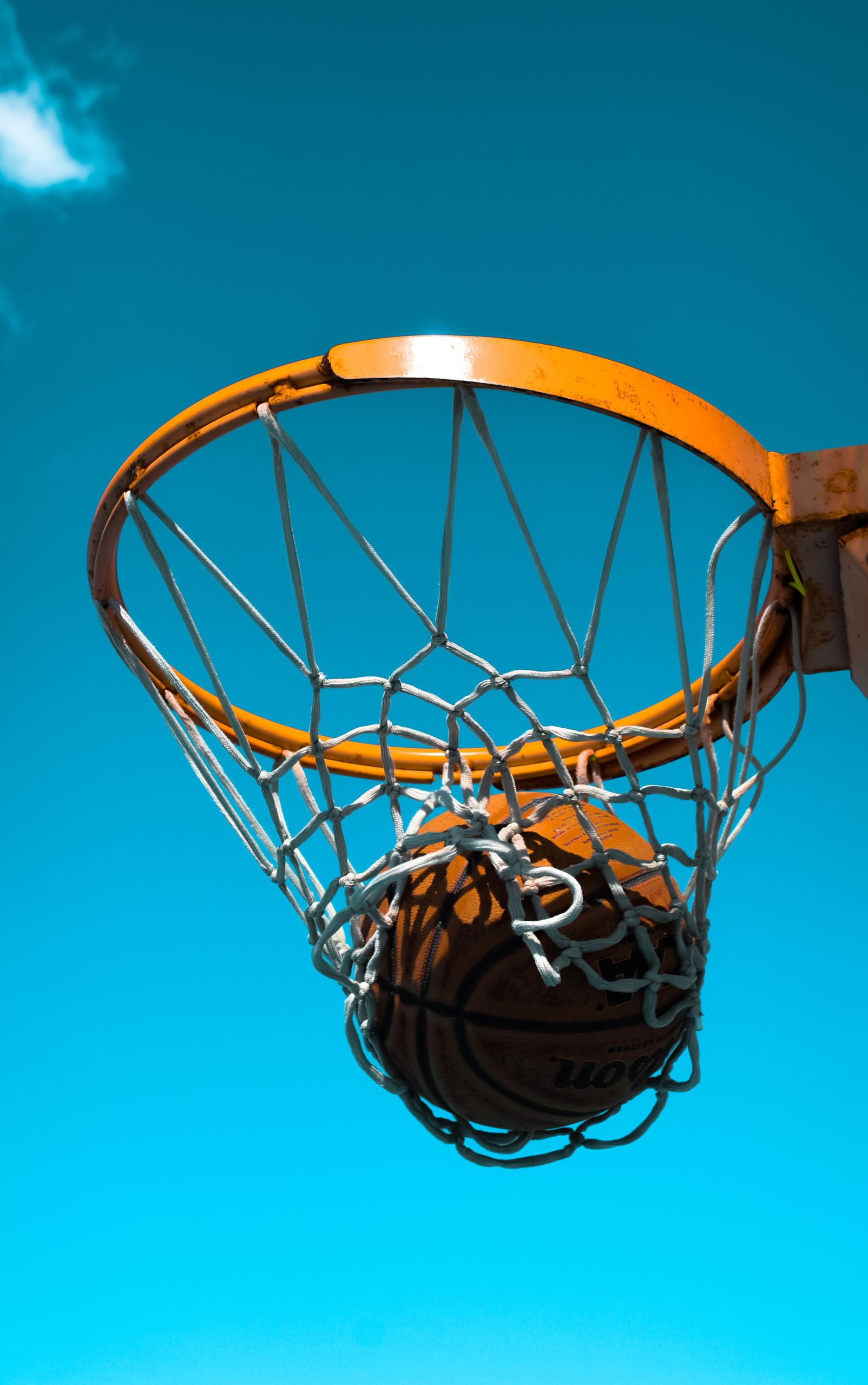 Basketball hoop with basketball going through