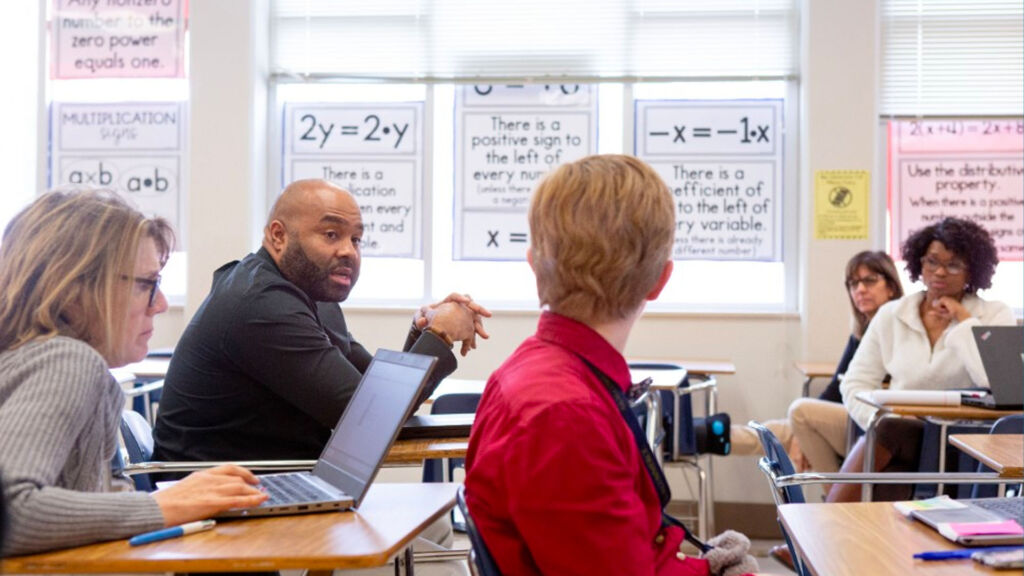 teacher talking in a classroom