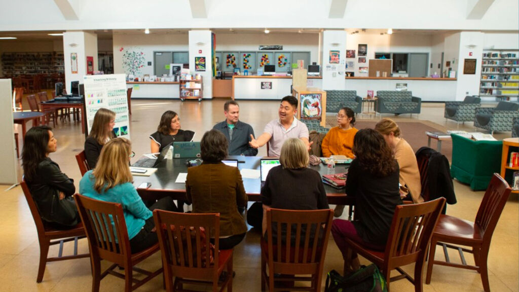 teachers meeting in a library