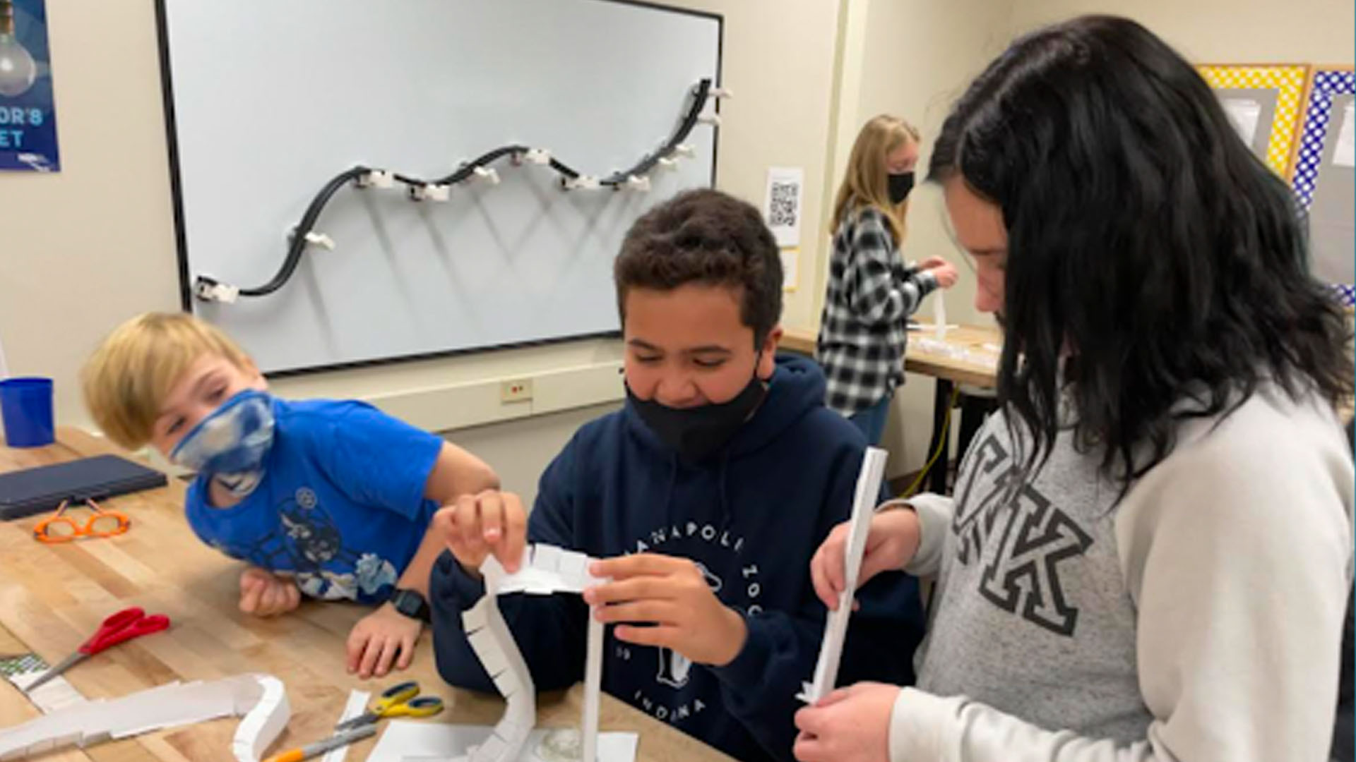 Students working on a paper STEM projects