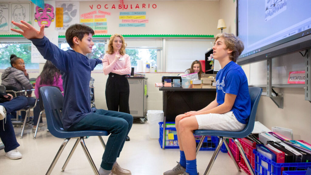 students performing vocab words in classroom