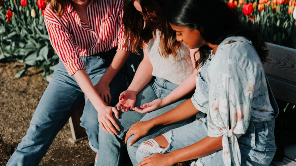 three young girls supporting eaching