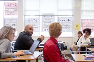 teachers meeting in a classroom