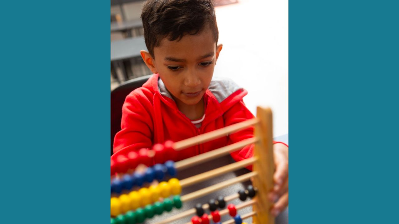 child working with an abacus