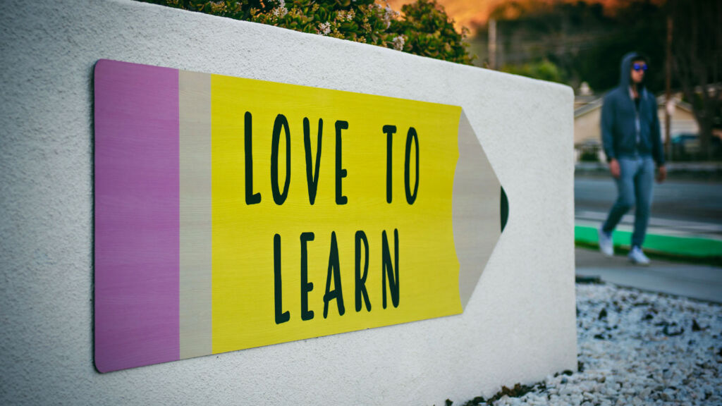 Love to Learn Sign in front of a school