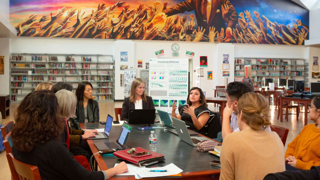 Teachers meeting in a library