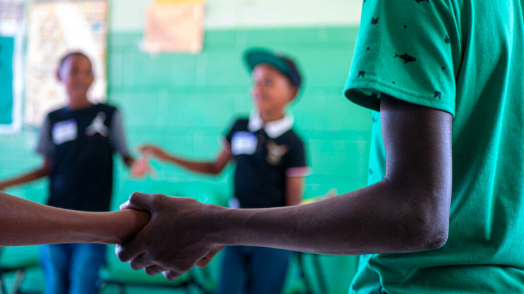 Children holding hands in a circle