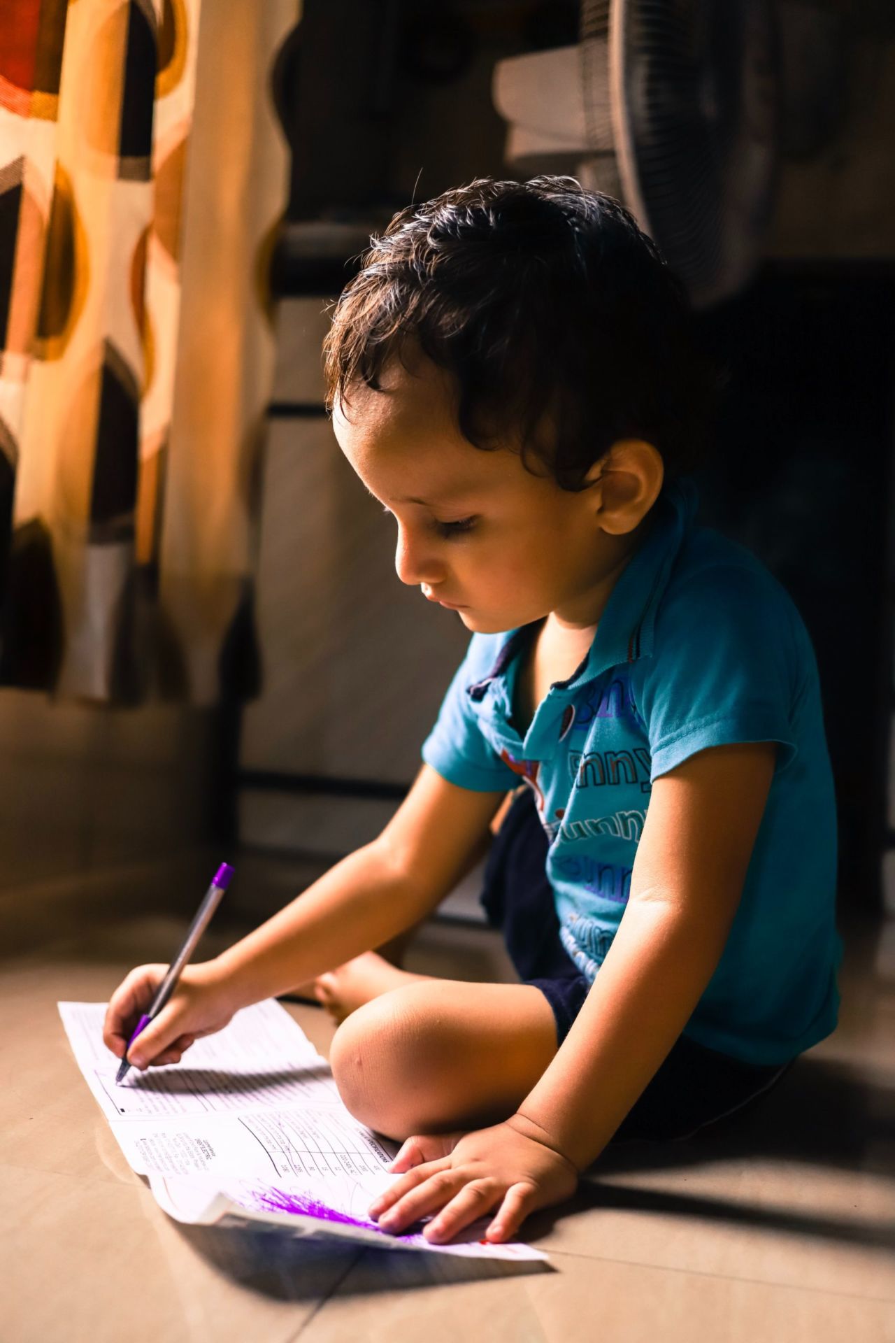 Child writing and reading.