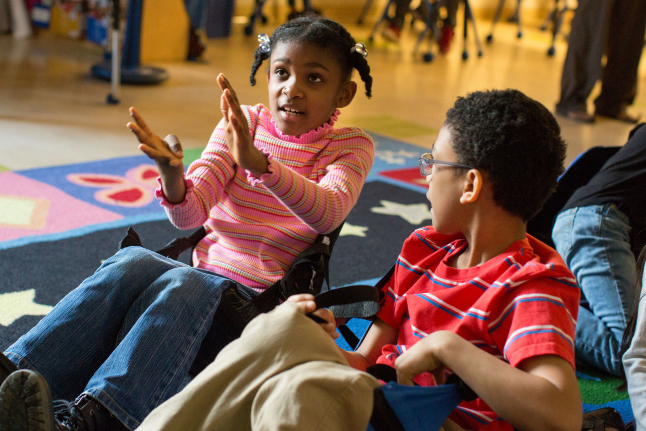Two students talking together.