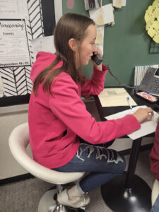 Student showing how to make a professional phone call.