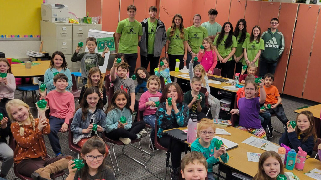 Students posing for a picture in the classroom.