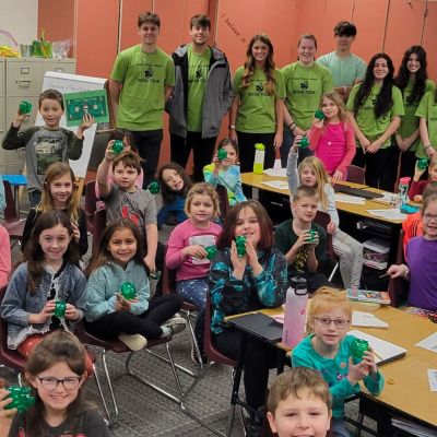 Students posing for a picture in the classroom.