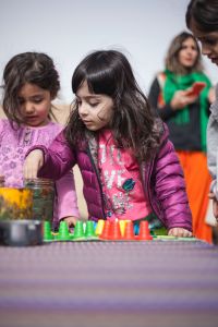 Children playing in a classroom setting.