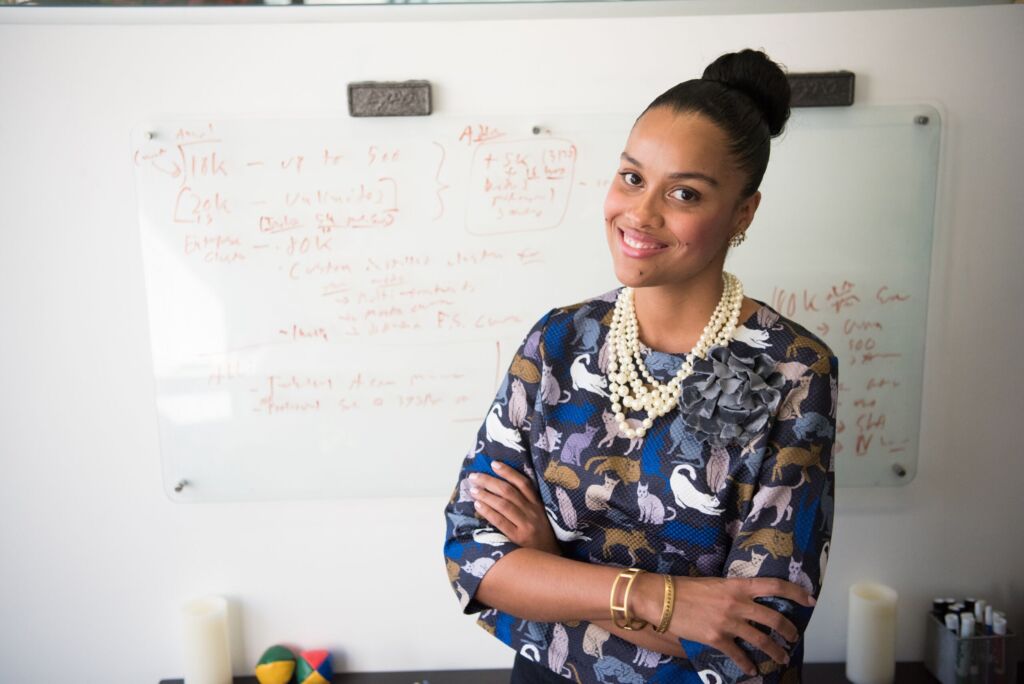 Teacher in front of a whiteboard.