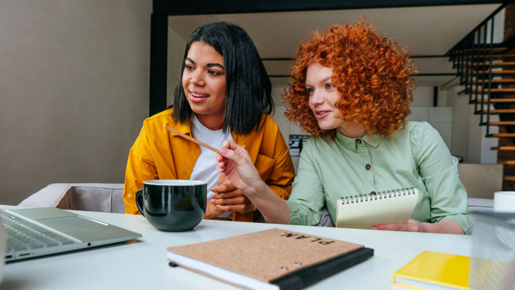 Two adults reviewing some content.