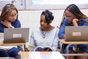 Three women working together.