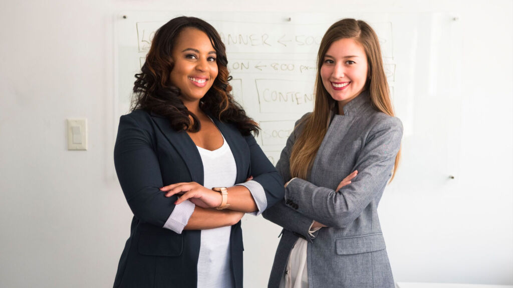 Two women posing for a picture.