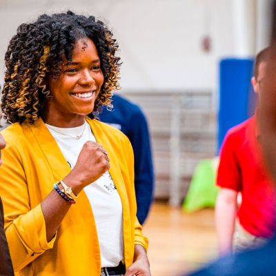 Administrator speaking to the students.