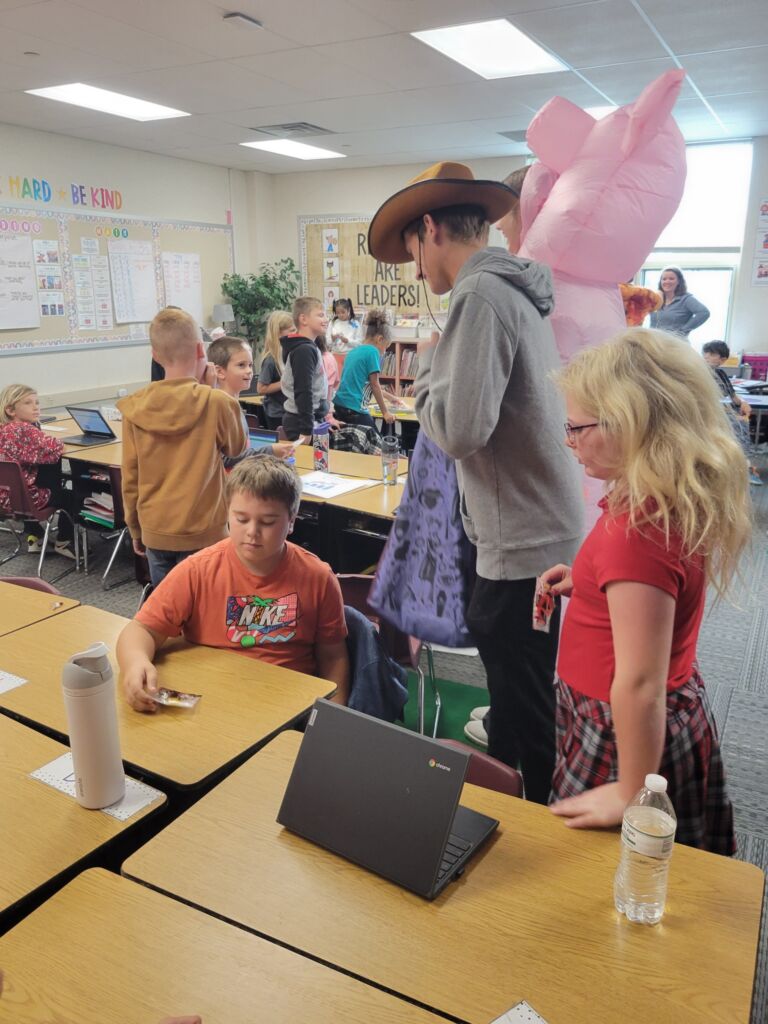 Students doing Reverse Trick or Treating.