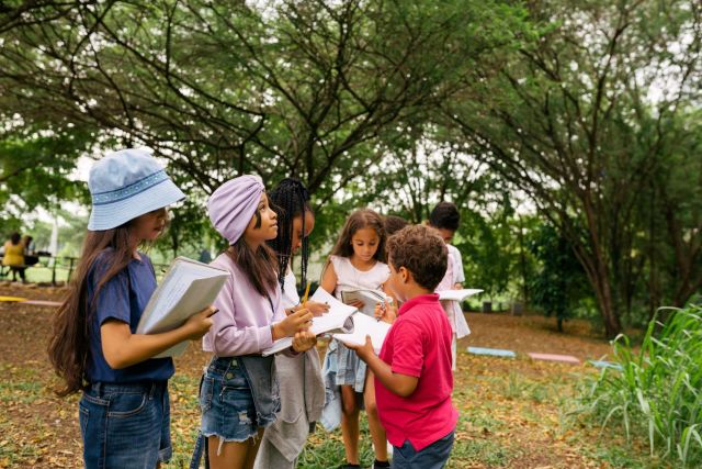 Students outside with books.