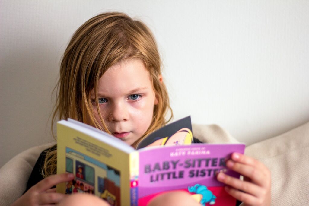 Child reading a book.