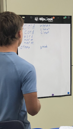 Student working at the white board.