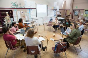 Teachers at Skyline High School meet with community partners to plan work-based learning opportunities for students.