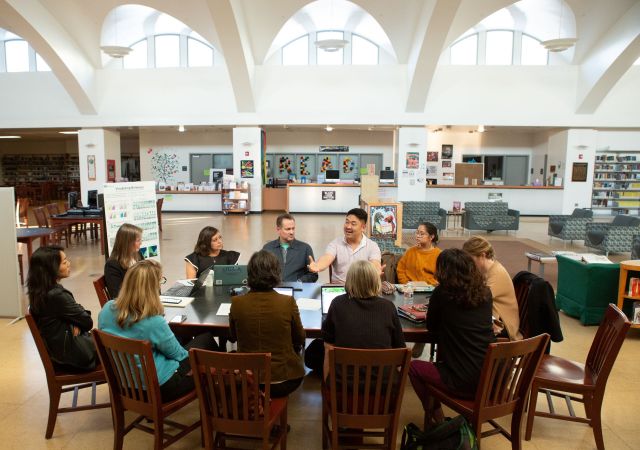 Teachers and staff from UCLA Community School meet with UCLA professors to discuss the various research projects happening at the school.