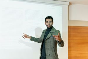 Teacher discussing projected content with the class.