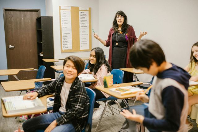 Teacher speaking to her students.