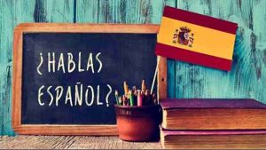 Hablas Español? on a small chalk board.