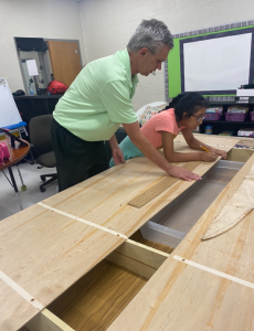 Jim and a student building the table.