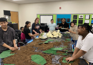 Students with the table recreating Iwo Jima.