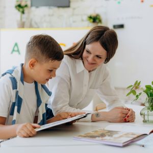 Mother reading with her son.