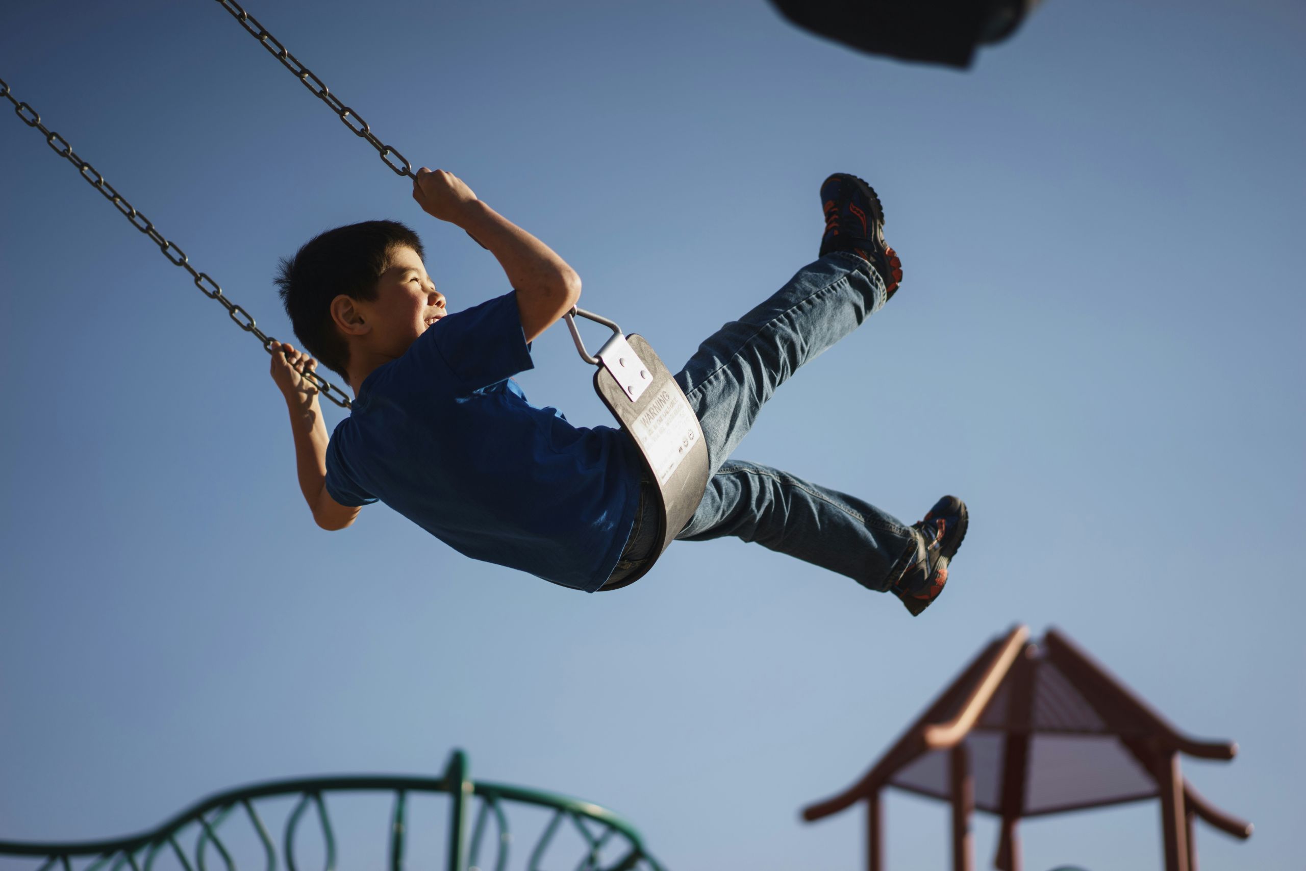 Child swinging on a swing.