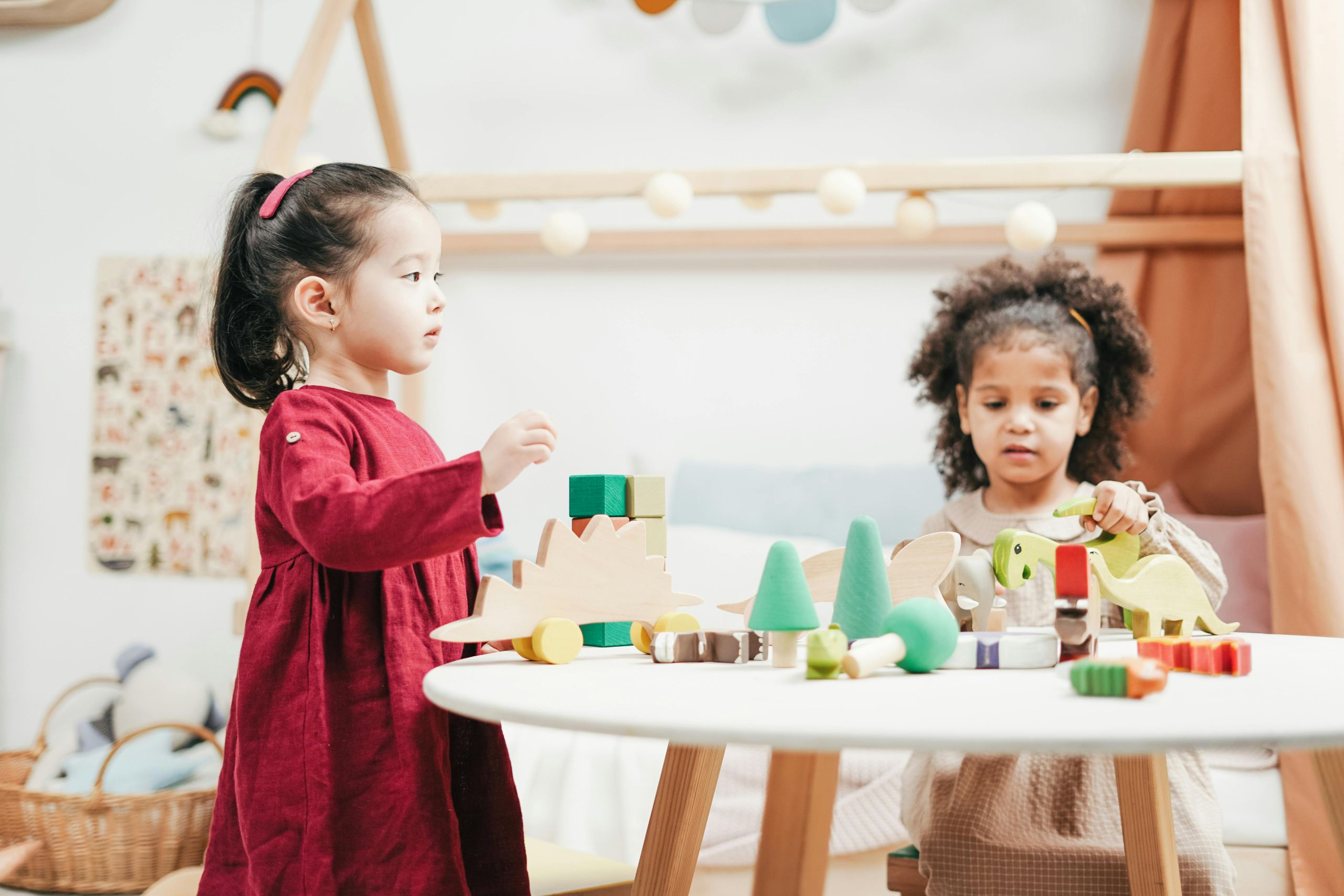 Two children playing together at a table.