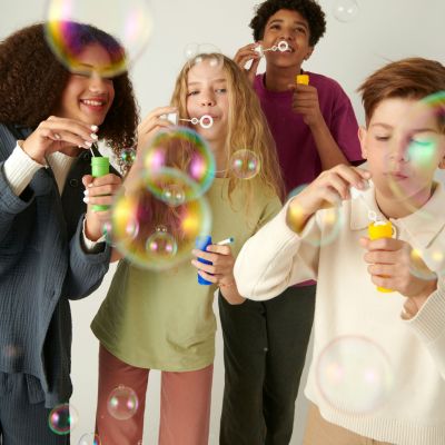 Students blowing bubbles.