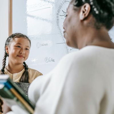 Happy student with teacher.