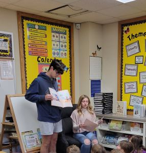 Students reading a book.