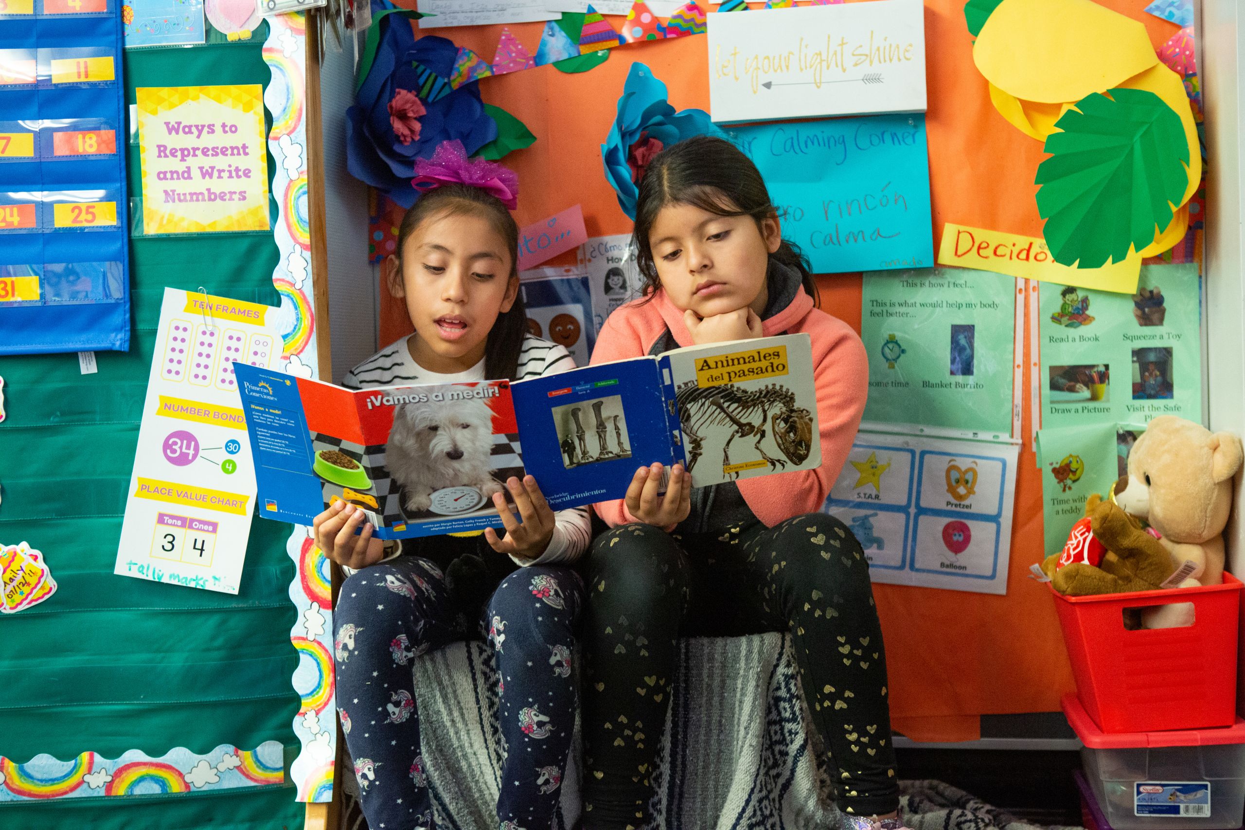 Two students in a combined second- and third-grade class read together.